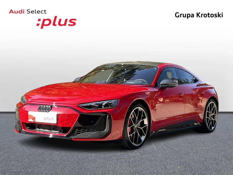 Czerwone Audi e-tron w studiu z identyfikacją Audi Select :plus